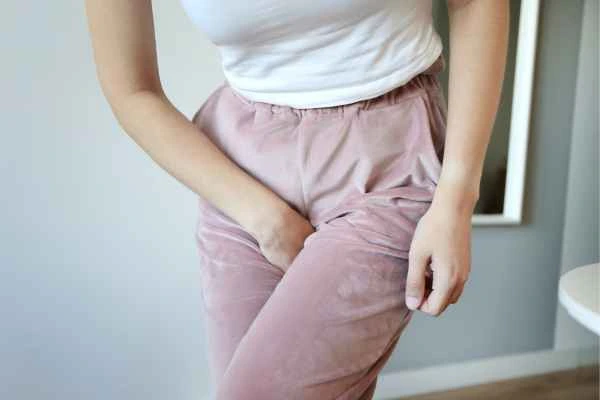 woman struggling with urine incontinence Whitley Sands